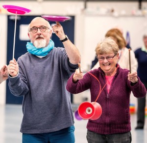 Dr. Graham McFarlane and Rosemary McKeever enjoy Streetwise Circus skills. 