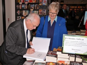 John C. Hewitt signs a copy of his book for Anne Hailes at the launch in Waterstones.