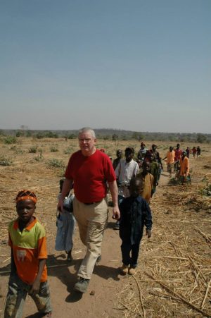 In Africa with his children of the village