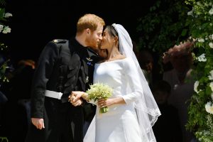 Prince Harry and Meghan Markle kiss on the steps of St George's Chapel in Windsor Castle after their wedding. PRESS ASSOCIATION Photo. Picture date: Saturday May 19, 2018. See PA story ROYAL Wedding. Photo credit should read: Ben Birchall/PA Wire