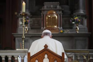 Pope Francis prays inside St Mary's Pro Cathedral during his visit to Dublin, Ireland, Saturday, Aug. 25, 2018. (Stefano Rellandini/Pool Photo via AP)