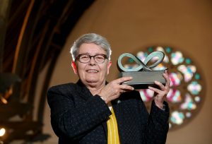 Eileen Weir, the recipient of the 2018 Community Relations Council Exceptional Achievement Award, pictured accepting her award at The Duncairn.