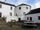 Bellalghy Bawn historic house once a plantation castle which also houses a Heaney library and a film by Heaney giving the history of the house.