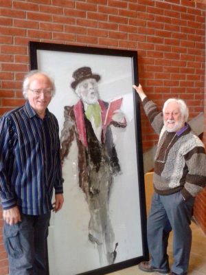 Sam with his close friend artist Neil Shawcross with Neil's painting of Sam as Dickens.