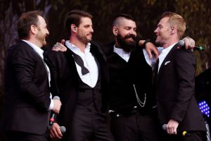 Boyzone: Keith Duffy looking smooth with open neck shirt and wayward bow tie